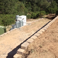 Schramsberg retaining wall for ground mount on steep hillside